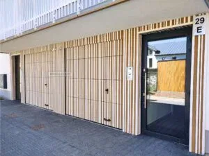 Brama segmentowa z okładziną Migas-Door